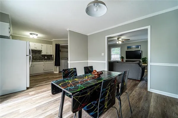 a view of a dining room with furniture and a table