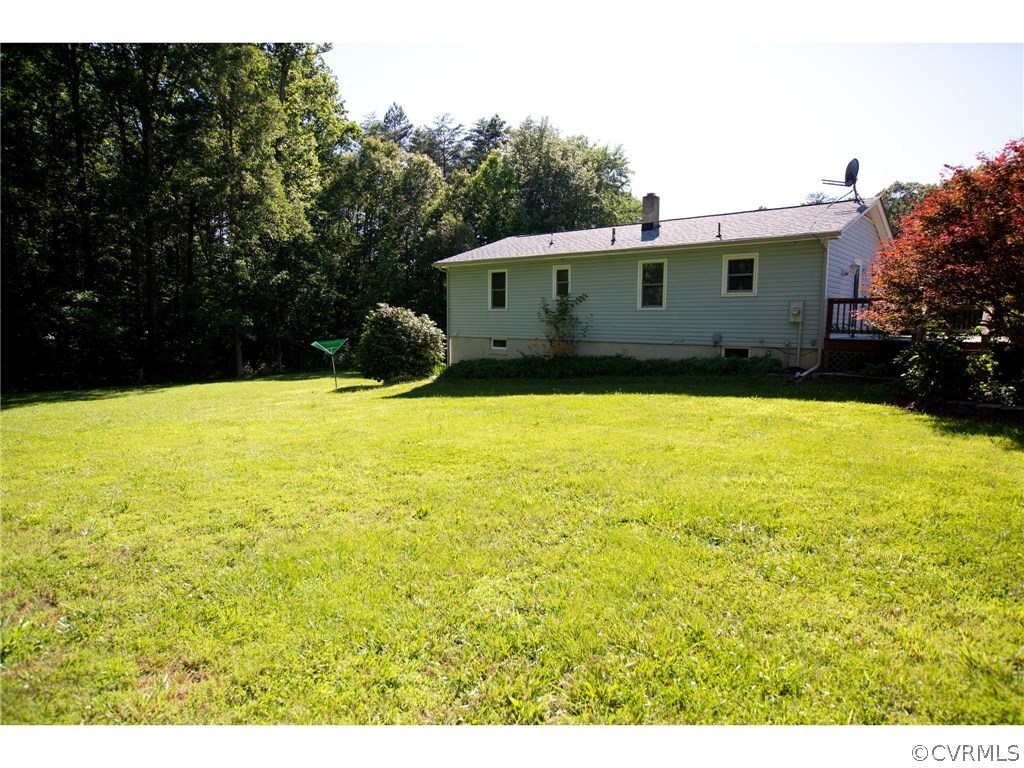 9361 West Bunker Hill Road Rice, VA 23966 - Photo 29 of 39 a front view of house with yard and trees in the background