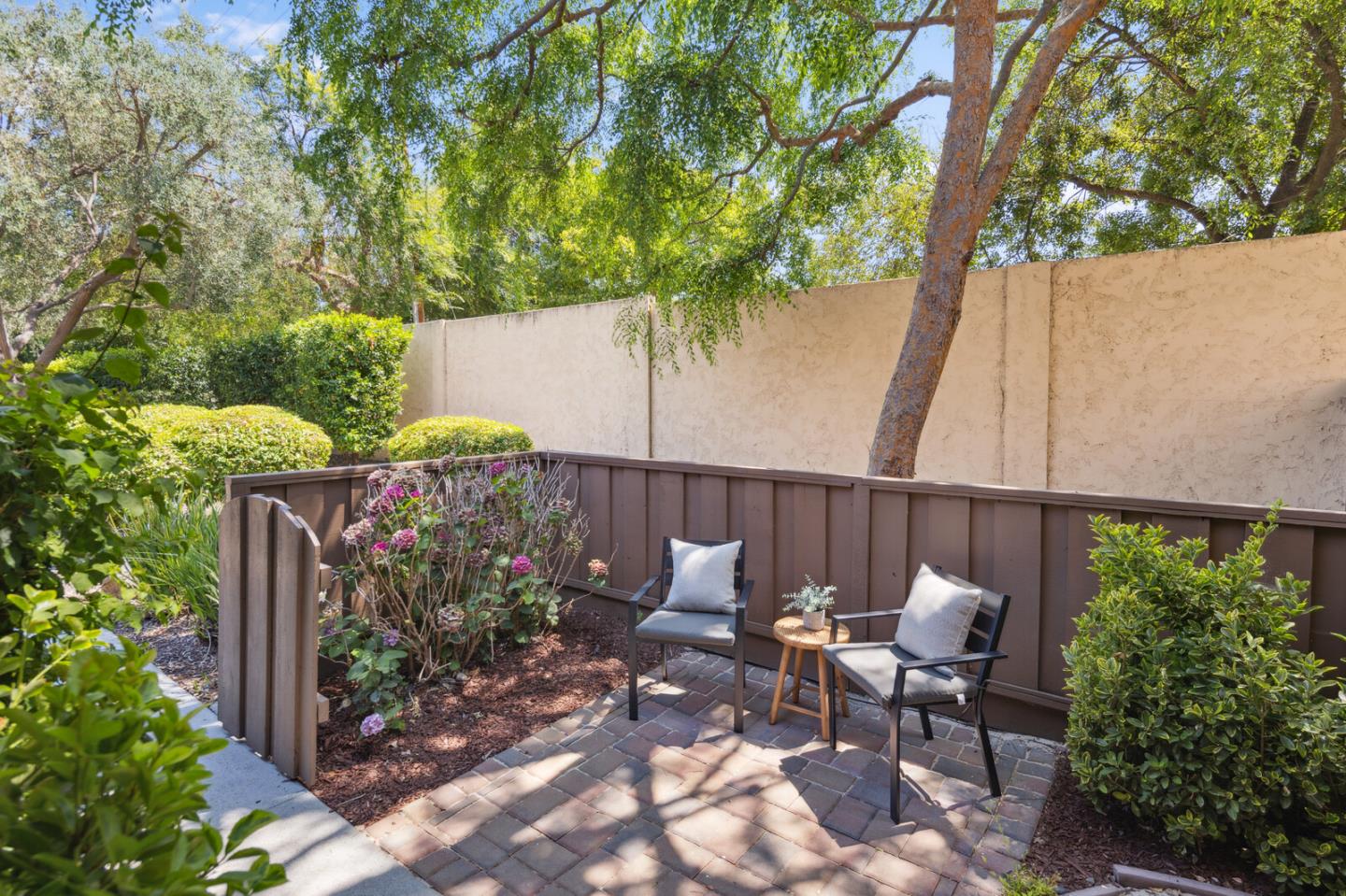 118 Granada Drive Mountain View, CA 94043 - Photo 16 of 28 a view of a chair and table in backyard