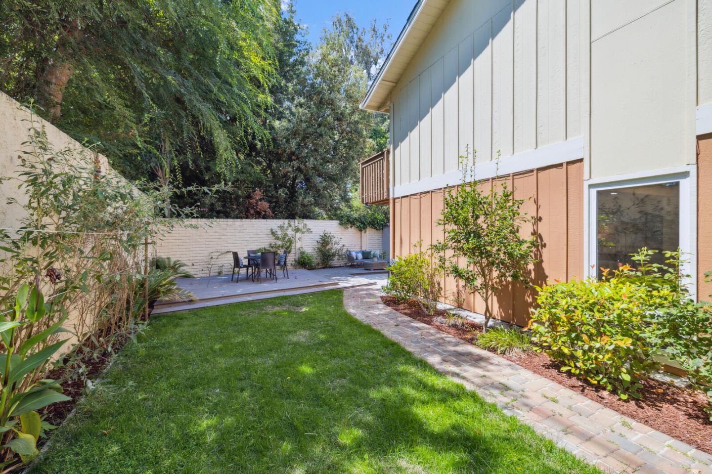 118 Granada Drive Mountain View, CA 94043 - Photo 22 of 28 a backyard of a house with table and chairs and potted plants