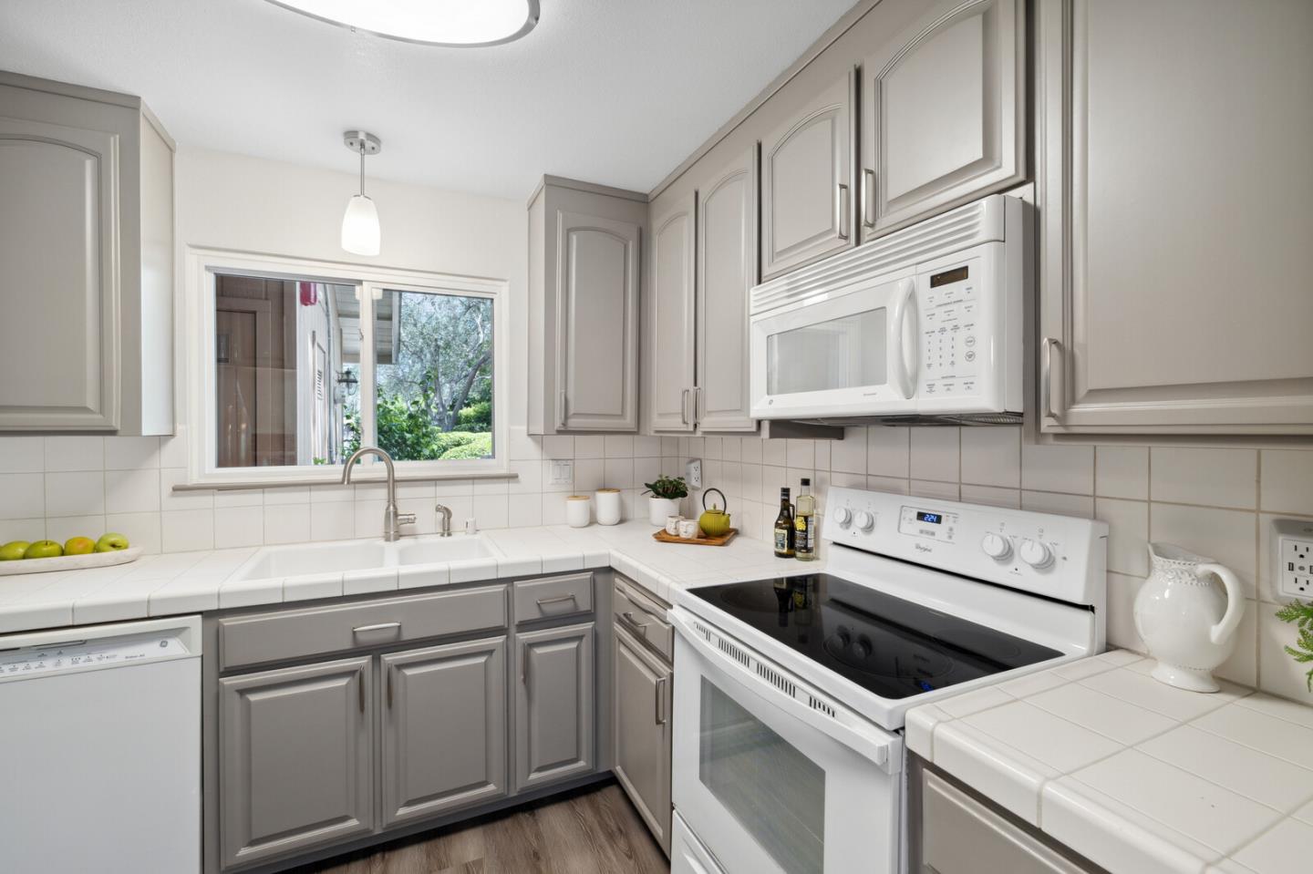 118 Granada Drive Mountain View, CA 94043 - Photo 4 of 28 a kitchen with stainless steel appliances granite countertop a sink a stove and cabinets