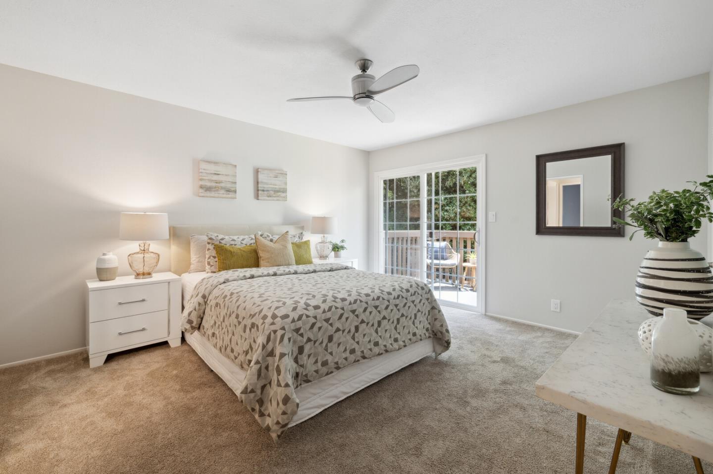 118 Granada Drive Mountain View, CA 94043 - Photo 9 of 28 a spacious bedroom with a bed and a large window