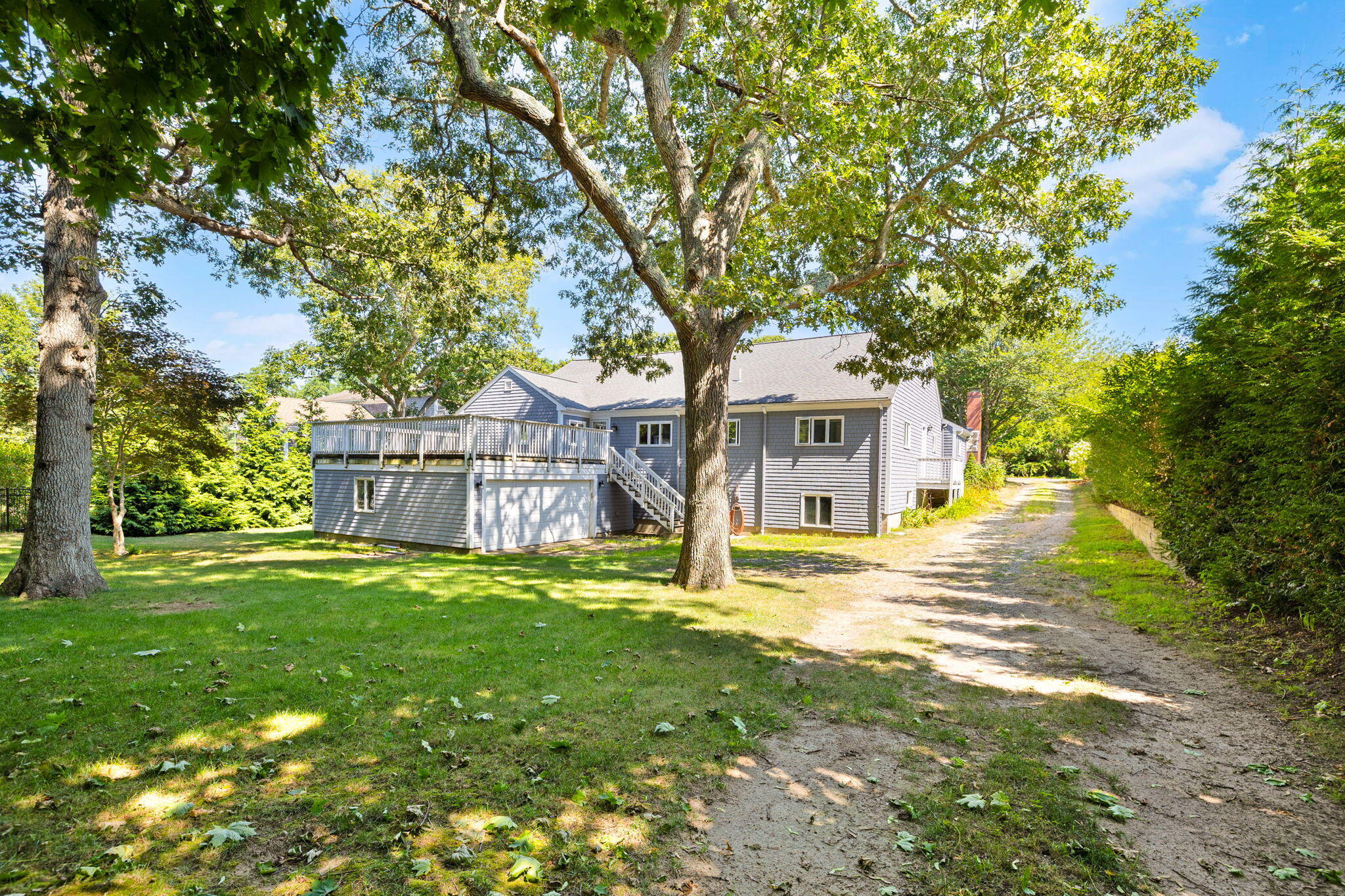 89 Swift Avenue Osterville, MA 02655 - Photo 11 of 57 a view of a house with a yard and tree s