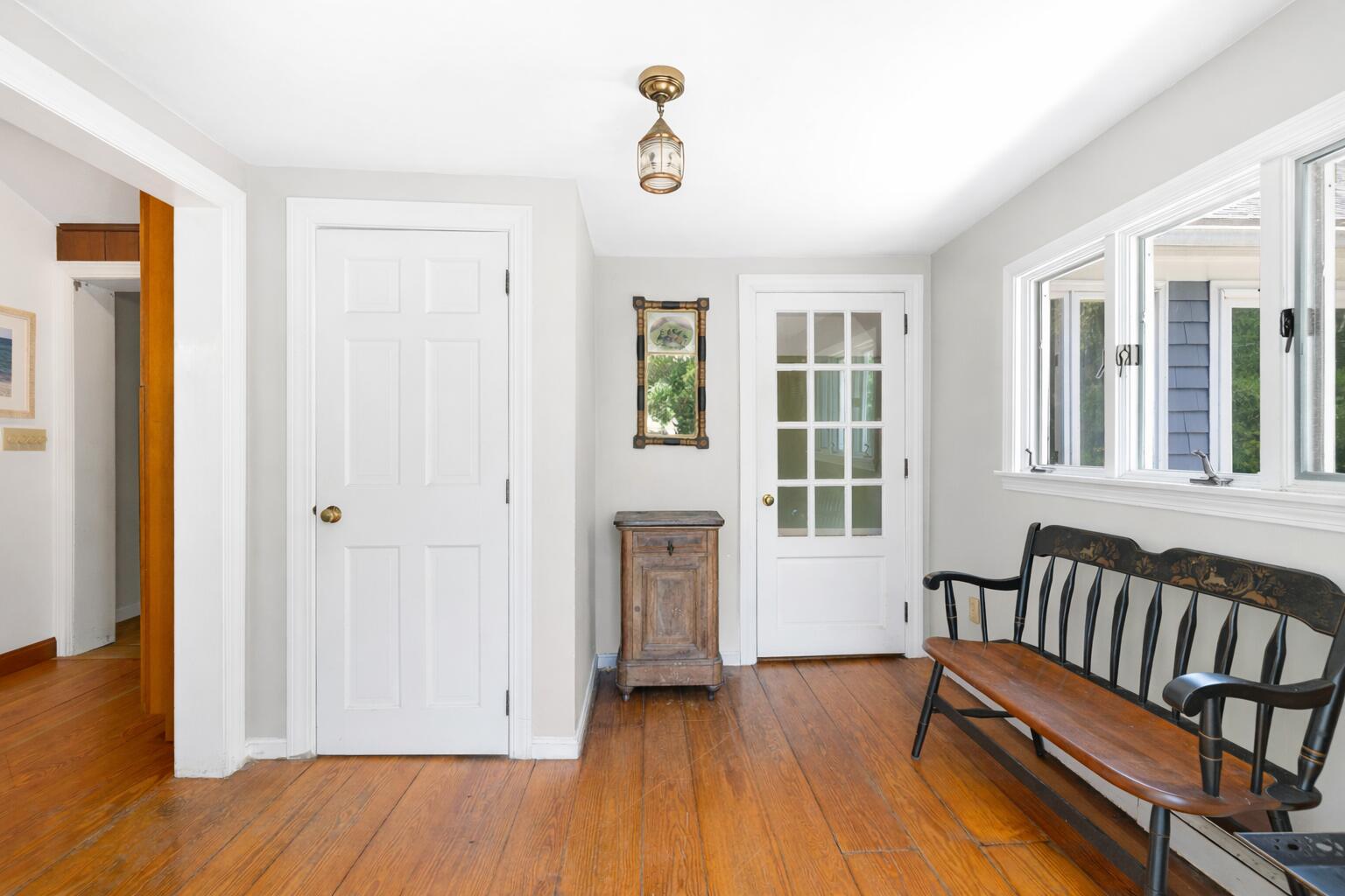 89 Swift Avenue Osterville, MA 02655 - Photo 18 of 57 a view of a bedroom with wooden floor and windows