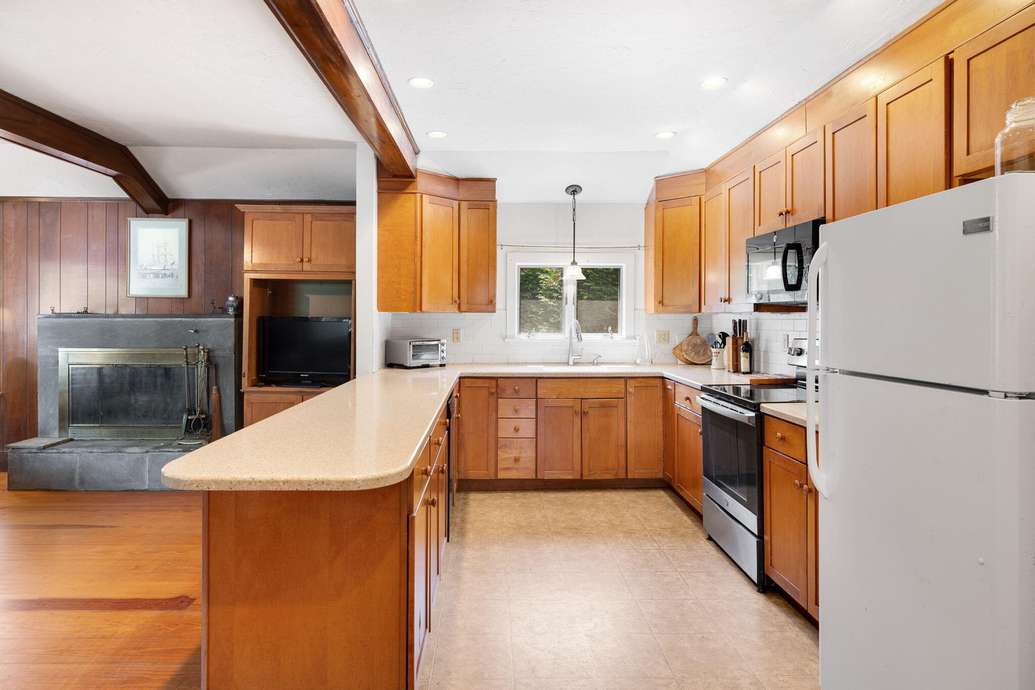 89 Swift Avenue Osterville, MA 02655 - Photo 20 of 57 a kitchen with a refrigerator a stove top oven a sink and dishwasher