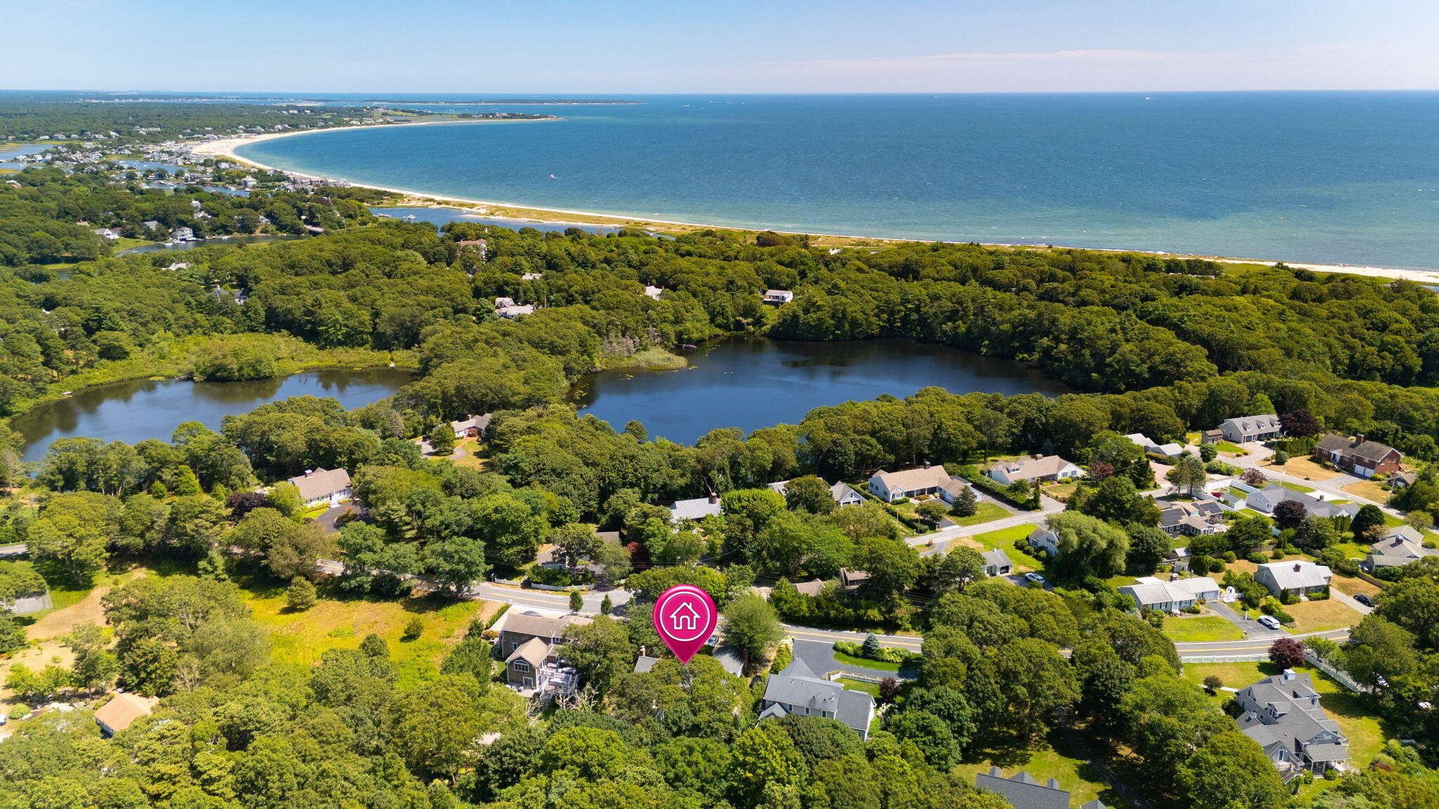 89 Swift Avenue Osterville, MA 02655 - Photo 48 of 57 a view of a lake with a yard