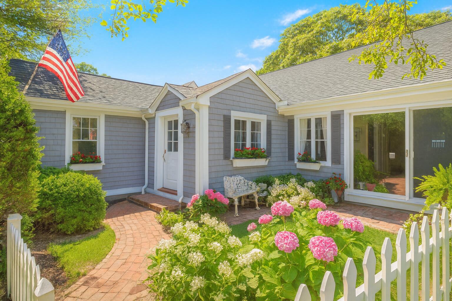 89 Swift Avenue Osterville, MA 02655 - Photo 6 of 57 a front view of house with an outdoor space