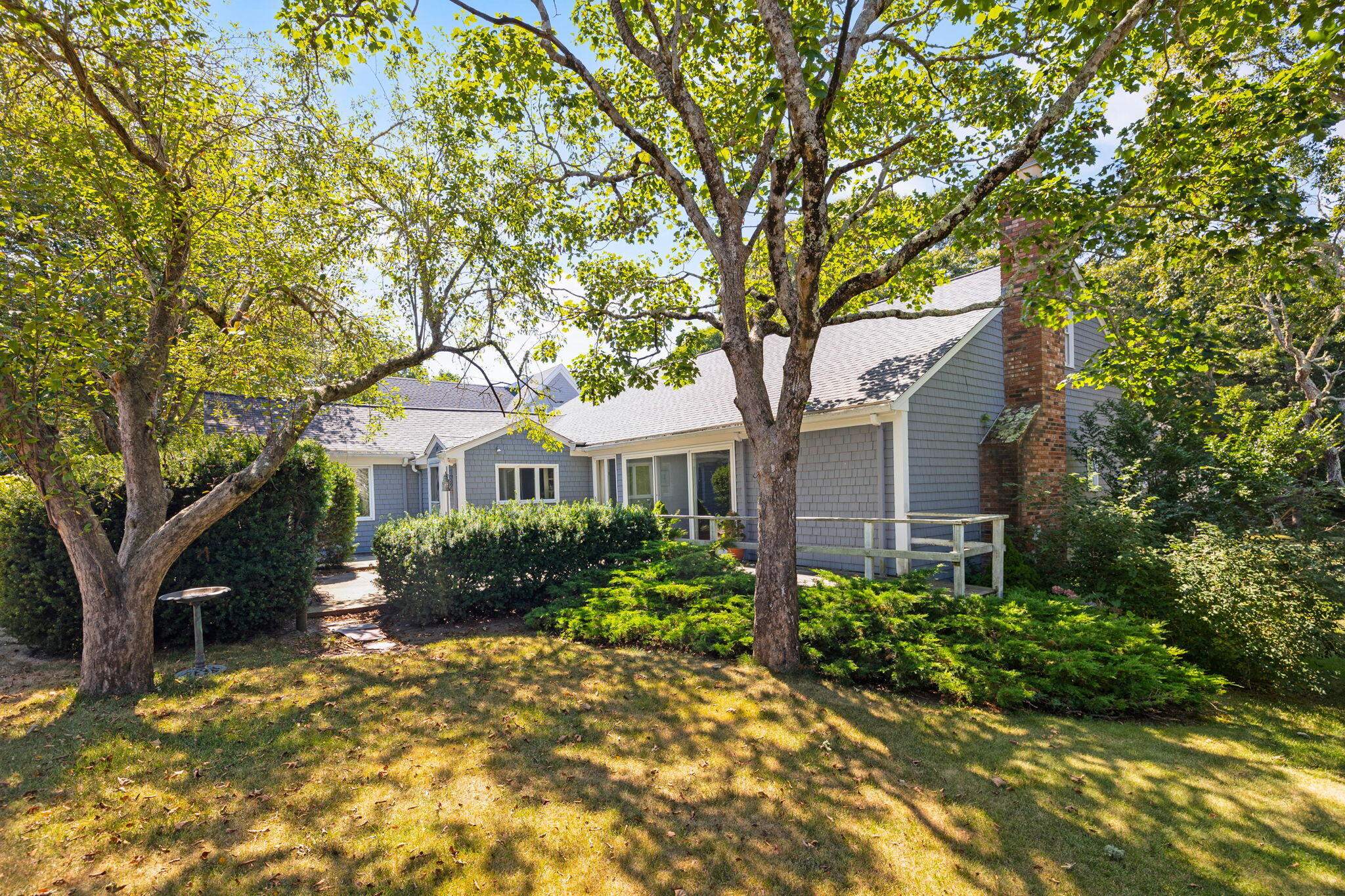 89 Swift Avenue Osterville, MA 02655 - Photo 7 of 57 a front view of a house with a garden