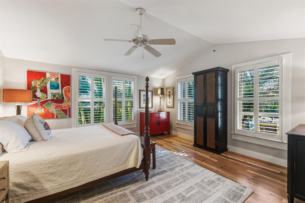 361 Tarpon Avenue Boca Grande, FL 33921 - Photo 12 of 25 a bedroom with a bed and glass door