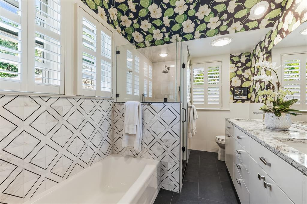 361 Tarpon Avenue Boca Grande, FL 33921 - Photo 14 of 25 a bathroom with a sink a mirror and a bathtub