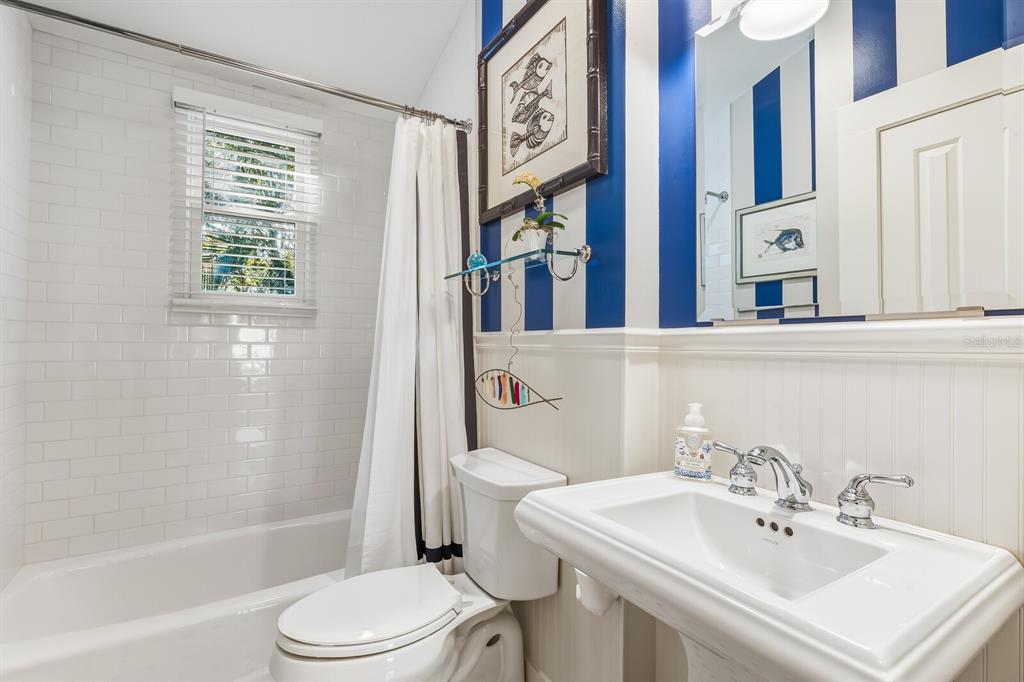 361 Tarpon Avenue Boca Grande, FL 33921 - Photo 17 of 25 a bathroom with a sink a toilet and shower