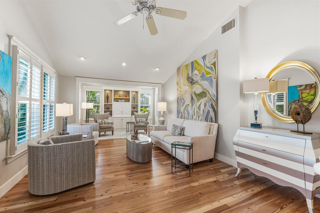 361 Tarpon Avenue Boca Grande, FL 33921 - Photo 5 of 25 a living room with fireplace furniture and a wooden floor