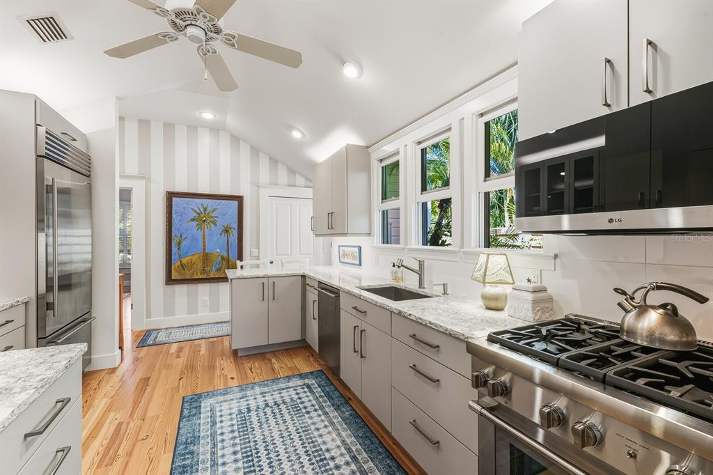 361 Tarpon Avenue Boca Grande, FL 33921 - Photo 9 of 25 a kitchen with a stove and a sink