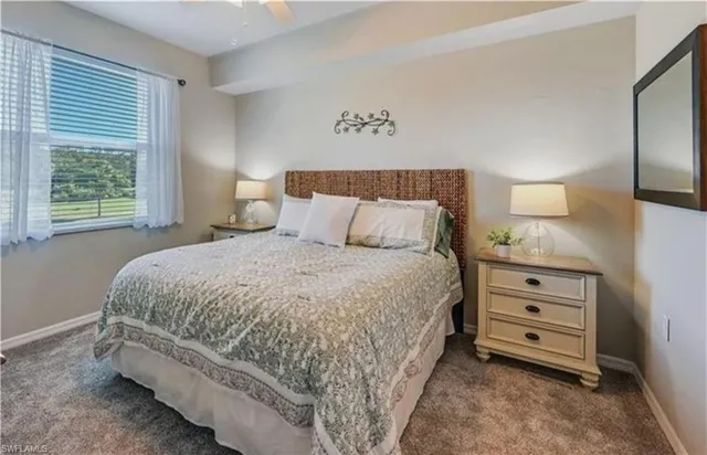 a bed room with a bed and a night stand