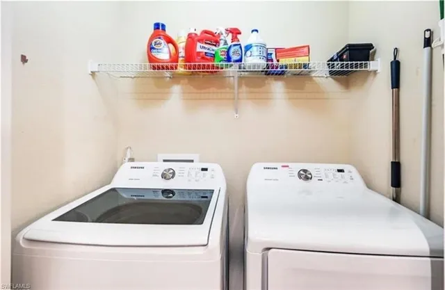 a utility room with dryer and washer