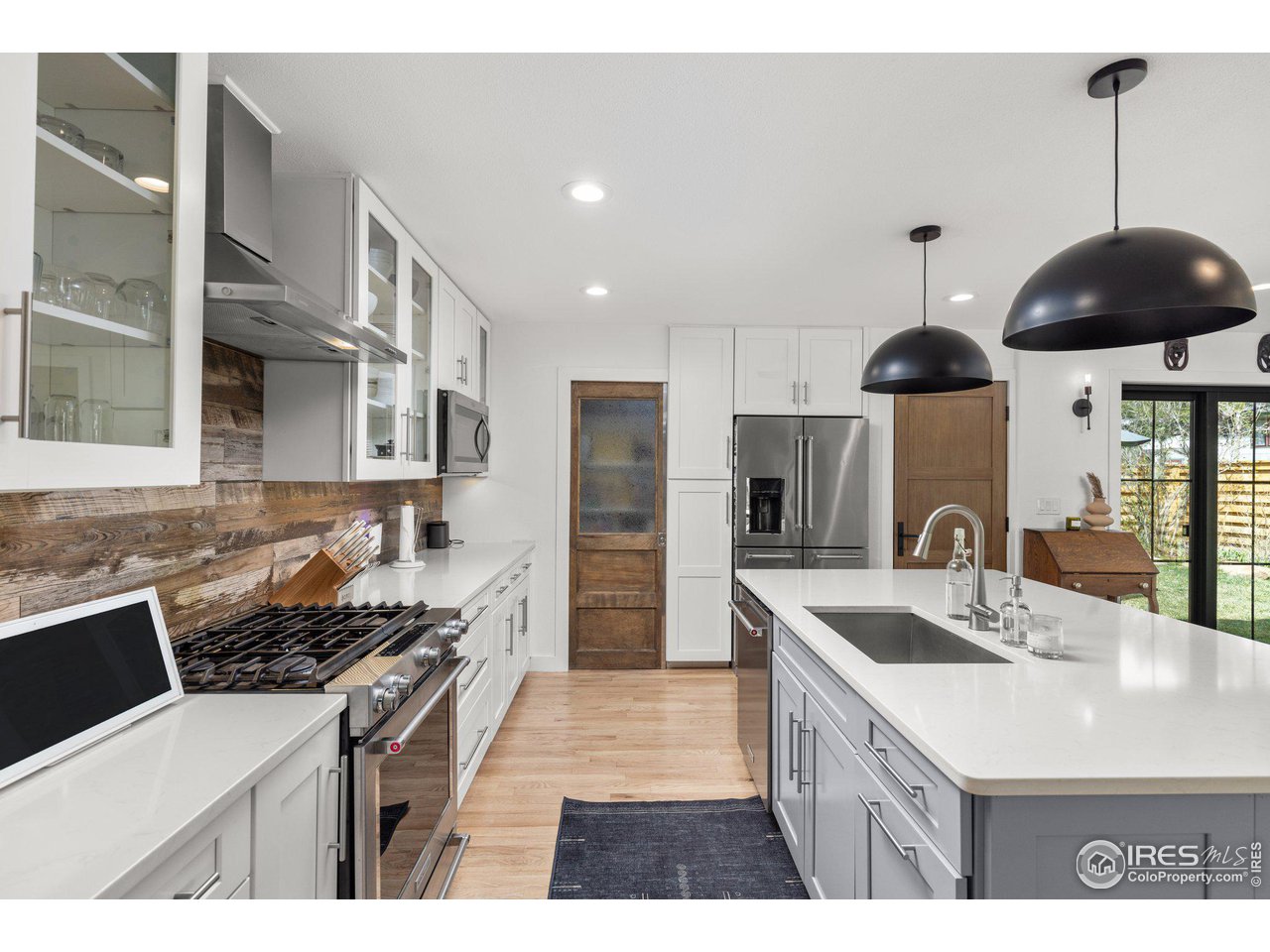 2685 Stephens Road Boulder, CO 80305 - Photo 11 of 40 a kitchen with stainless steel appliances granite countertop a sink a stove and a refrigerator