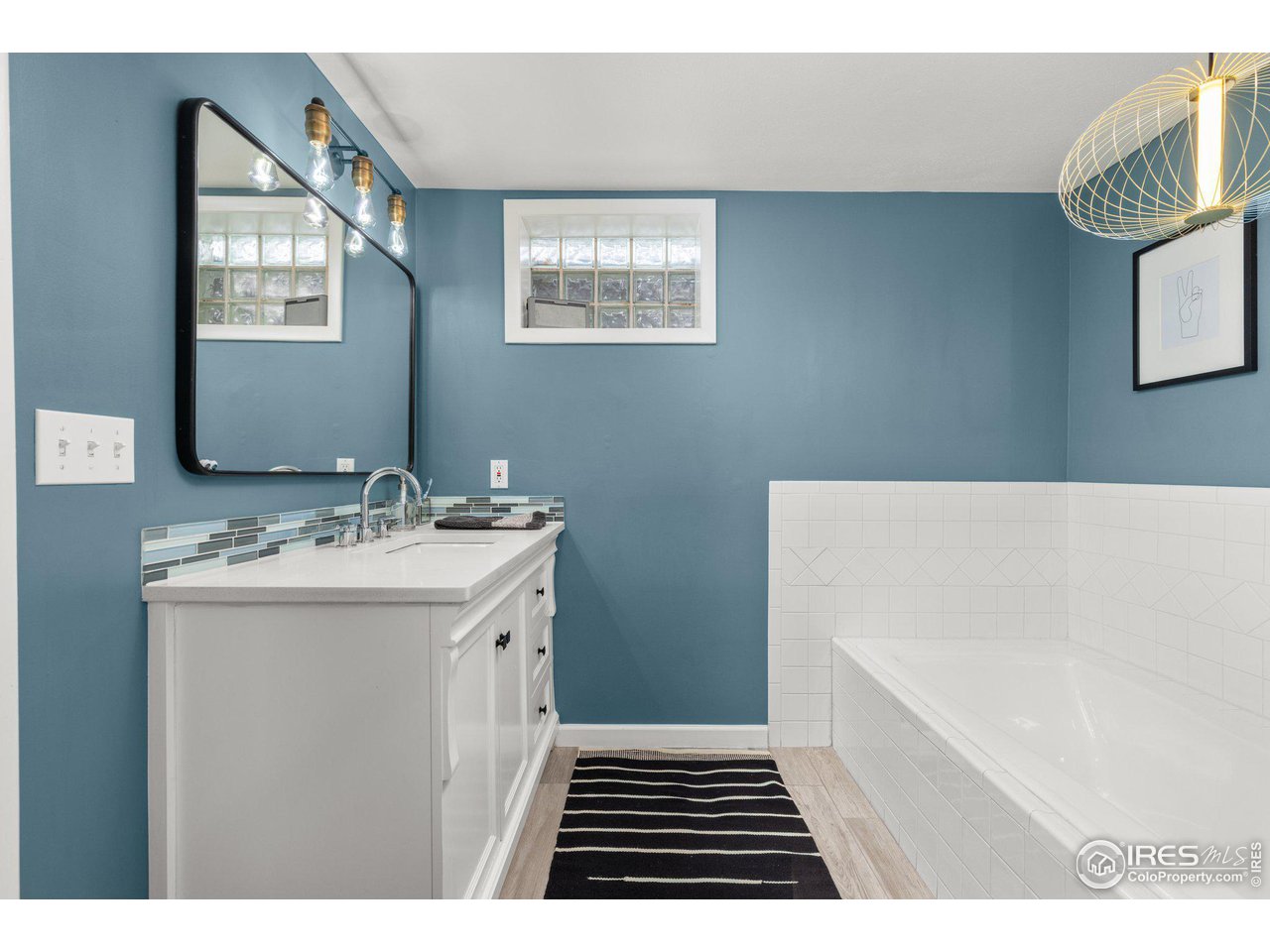 2685 Stephens Road Boulder, CO 80305 - Photo 16 of 40 a bathroom with a sink a toilet and mirror