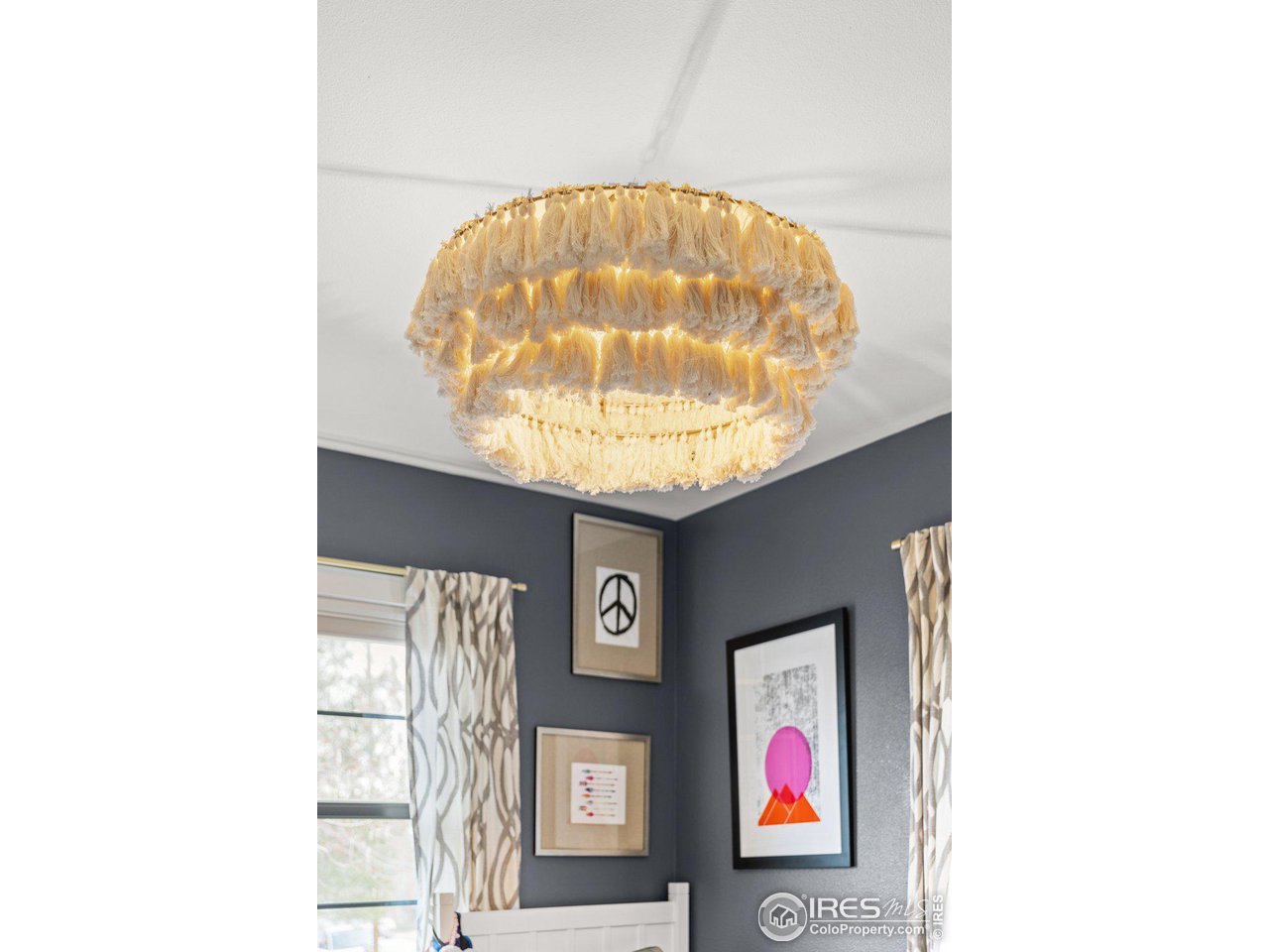 2685 Stephens Road Boulder, CO 80305 - Photo 21 of 40 a very nice looking hallway with a bunch of frames on wall