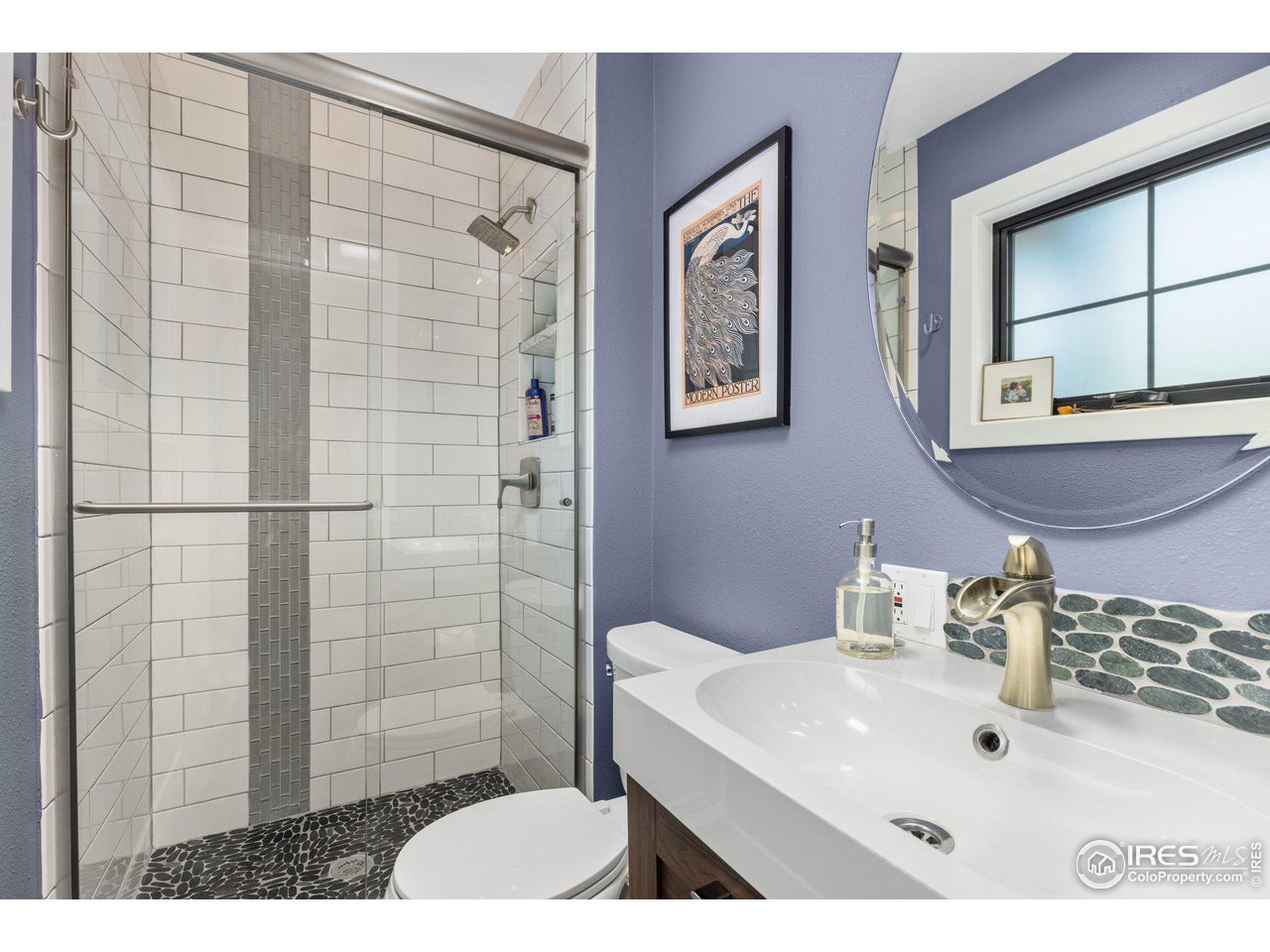 2685 Stephens Road Boulder, CO 80305 - Photo 22 of 40 a bathroom with a sink a mirror and shower
