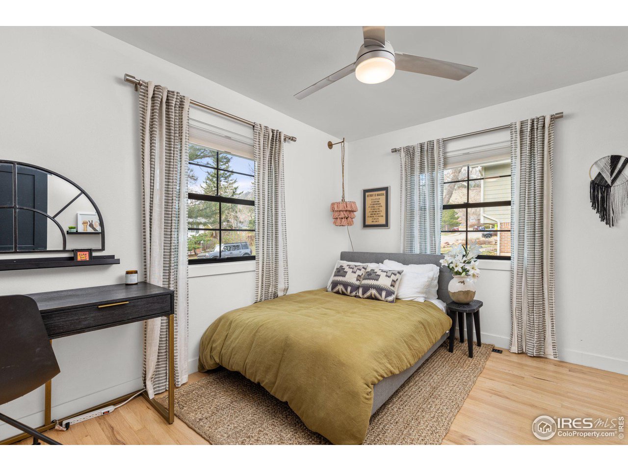 2685 Stephens Road Boulder, CO 80305 - Photo 23 of 40 a bedroom with a bed window and a table