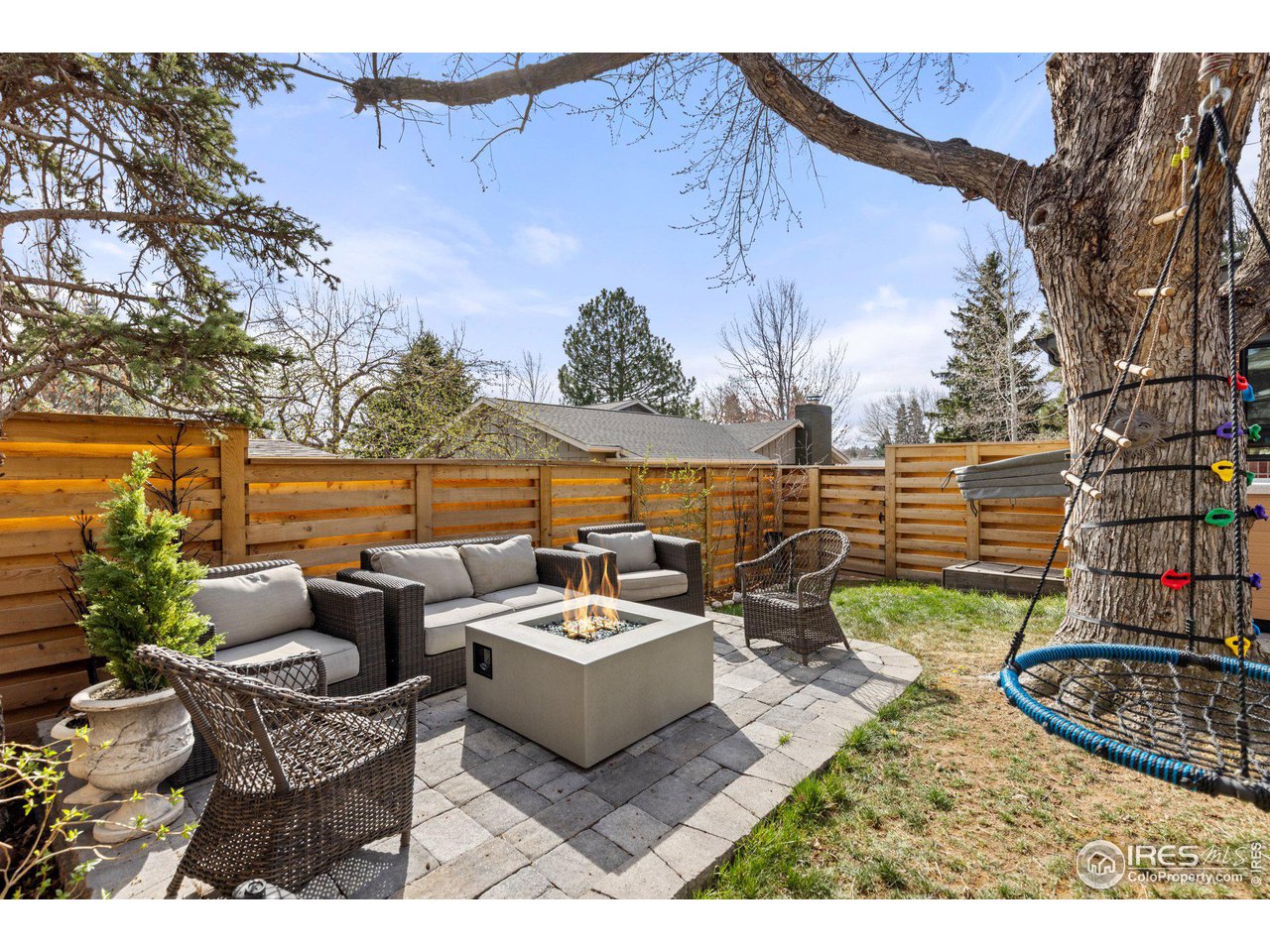 2685 Stephens Road Boulder, CO 80305 - Photo 33 of 40 a view of a patio with couches table and chairs under an umbrella