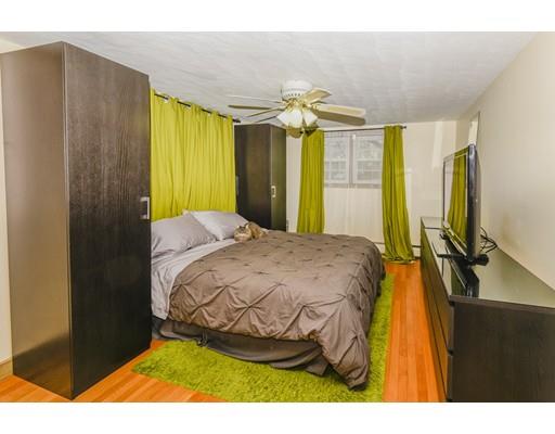 360 Sprague Street Dedham, MA 02026 - Photo 11 of 19 a bedroom with a bed and wooden floor