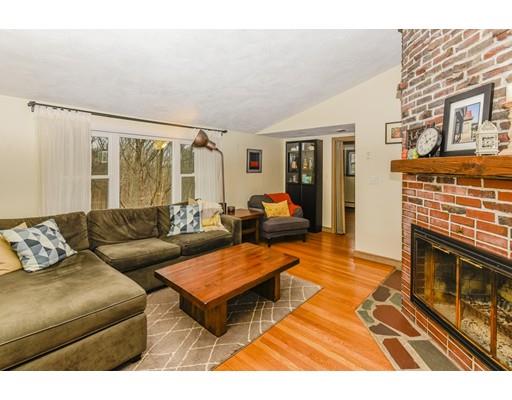360 Sprague Street Dedham, MA 02026 - Photo 3 of 19 a living room with furniture a fireplace and a flat screen tv