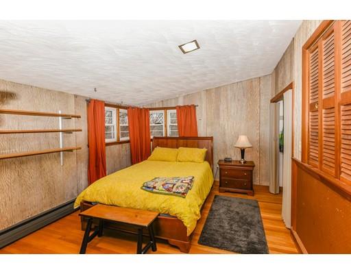 360 Sprague Street Dedham, MA 02026 - Photo 8 of 19 a bedroom with a bed and wooden floor