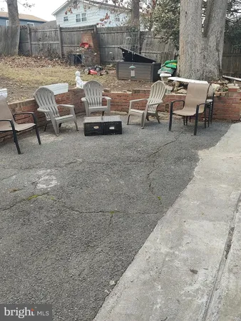 a view of a patio with table and chairs