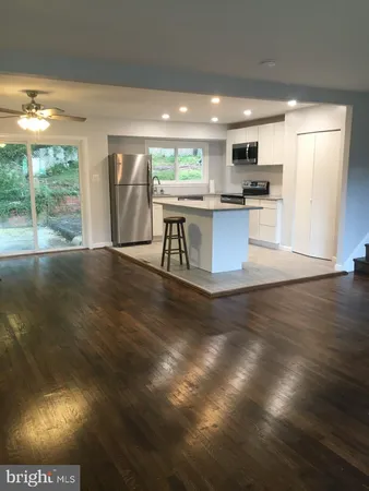 a view of kitchen with cabinets and outdoor space