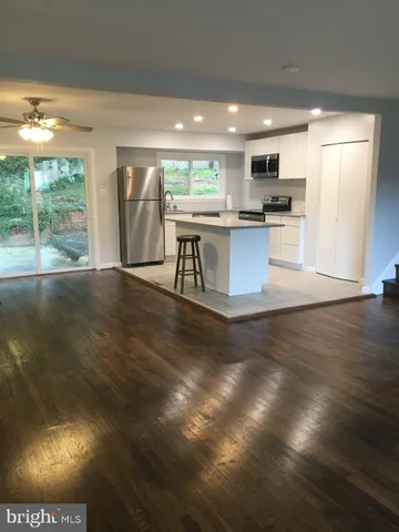 a view of kitchen with cabinets and outdoor space