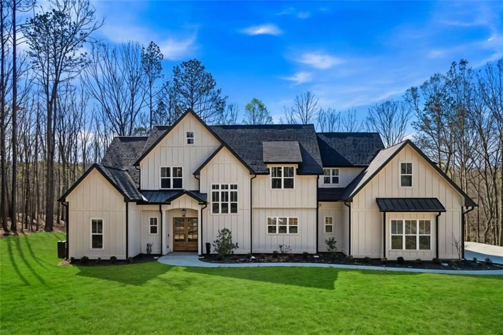 a front view of a house with a yard