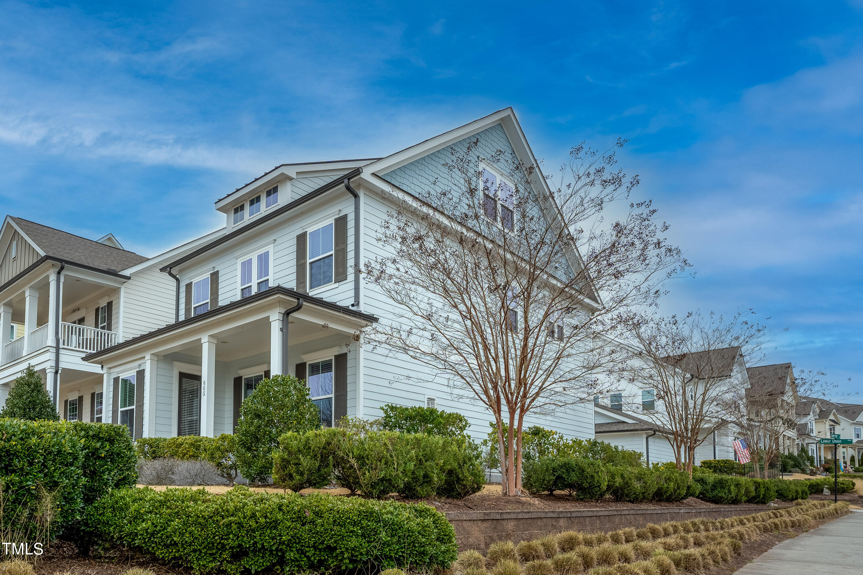 665 Old Dairy Drive Wake Forest, NC 27587 - Photo 1 of 30 a front view of a house with a yard