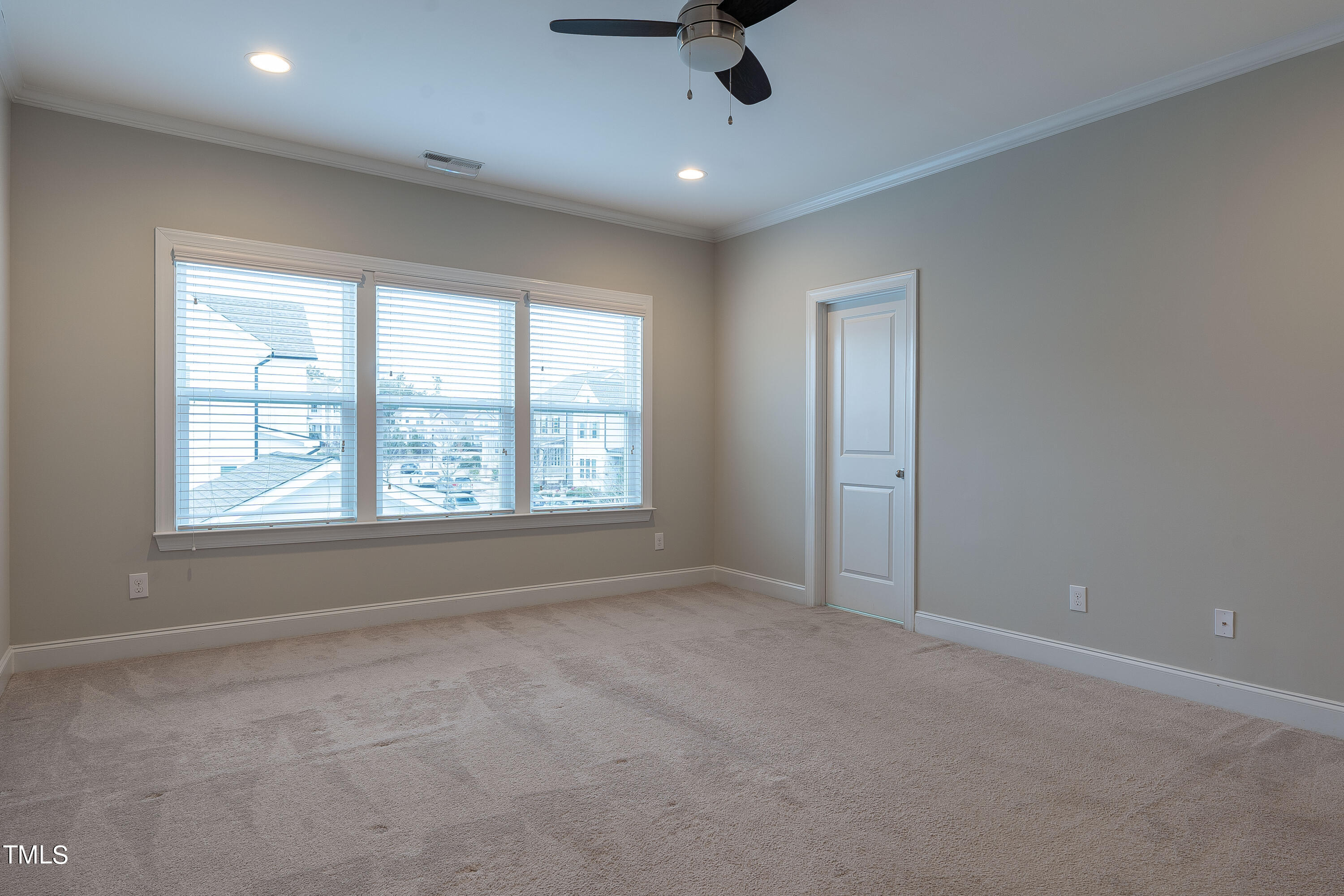 665 Old Dairy Drive Wake Forest, NC 27587 - Photo 12 of 30 an empty room with windows and fan view