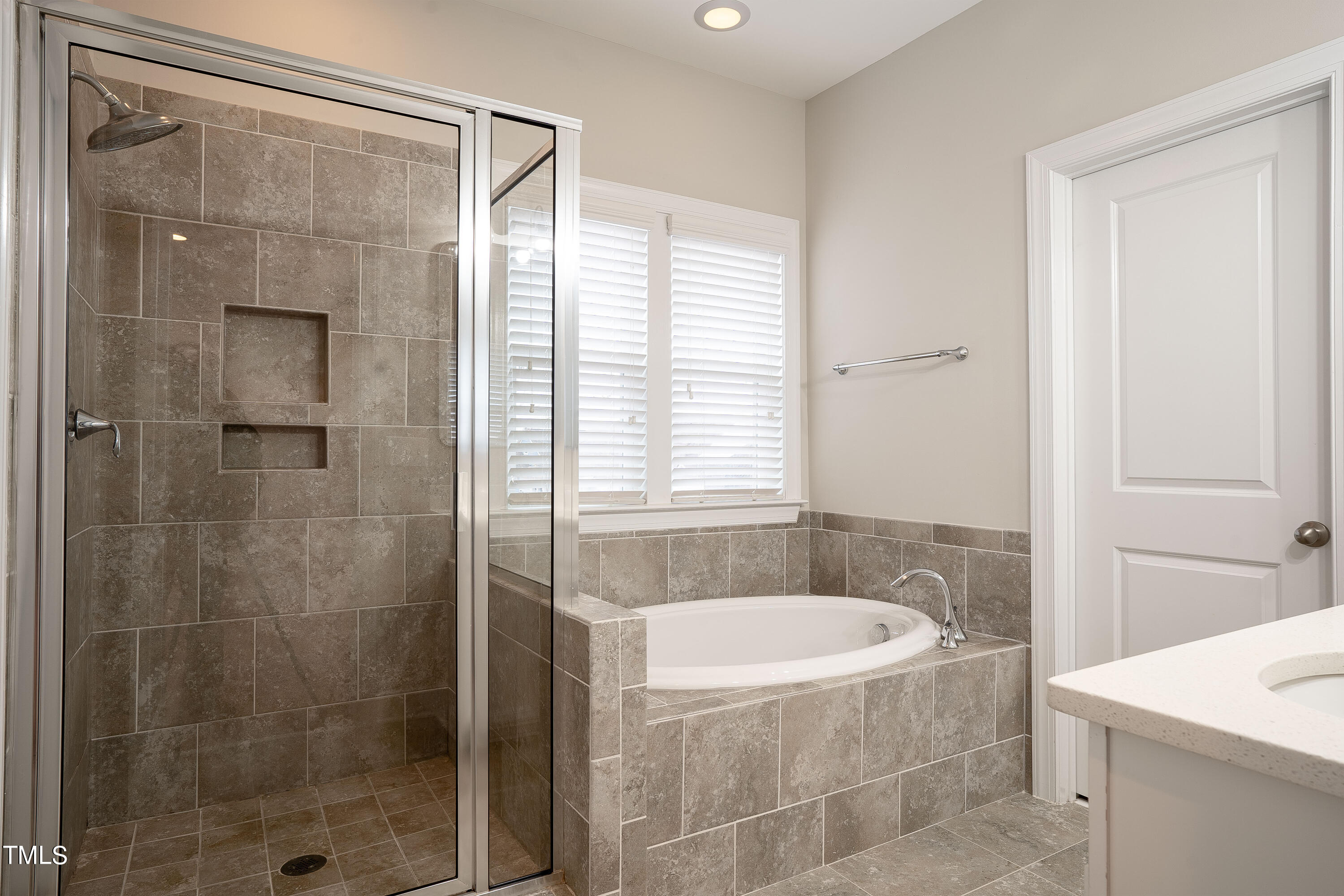 665 Old Dairy Drive Wake Forest, NC 27587 - Photo 13 of 30 a bathroom with a bathtub and shower