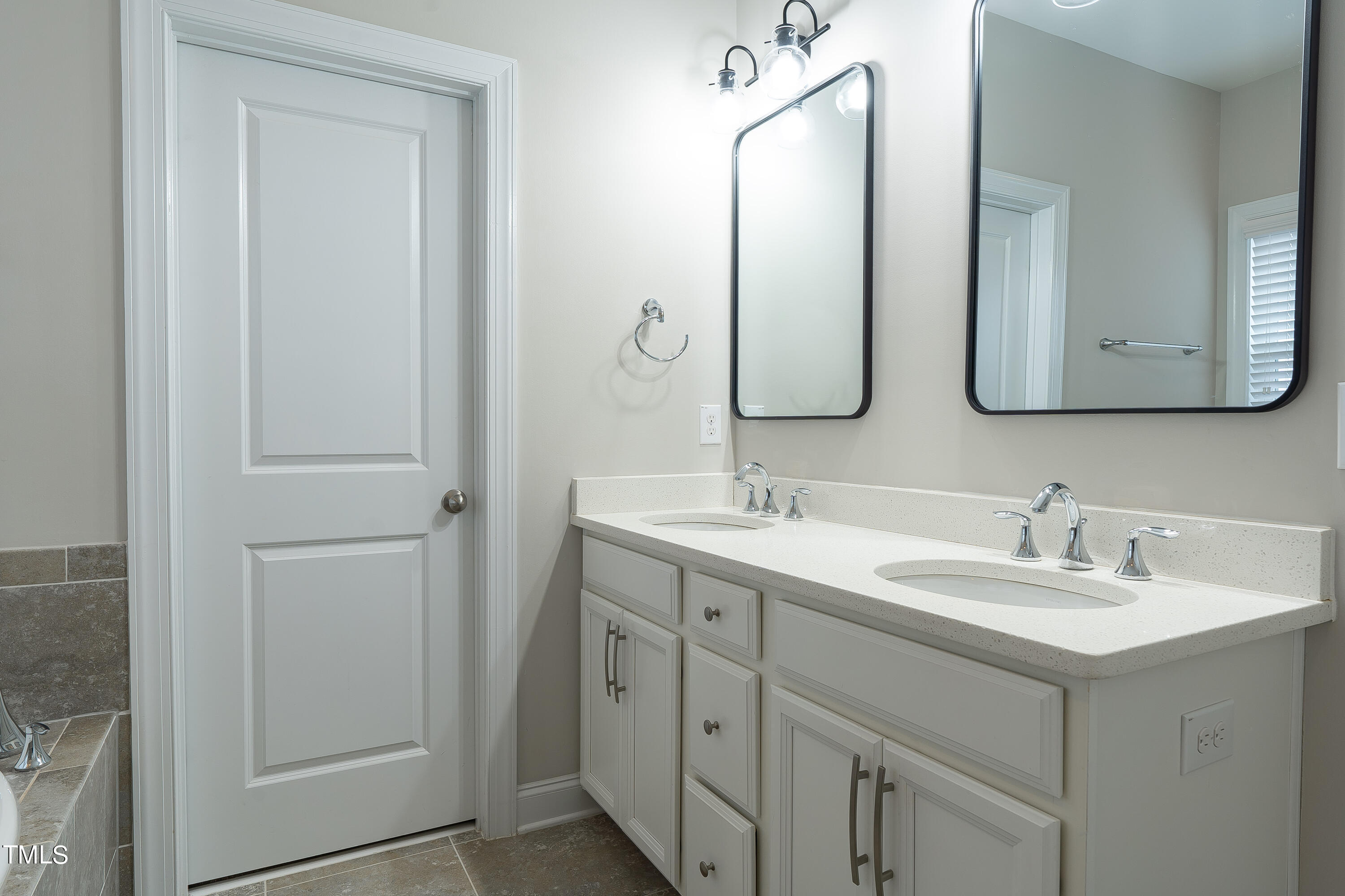 665 Old Dairy Drive Wake Forest, NC 27587 - Photo 14 of 30 a bathroom with a double vanity sink and mirror