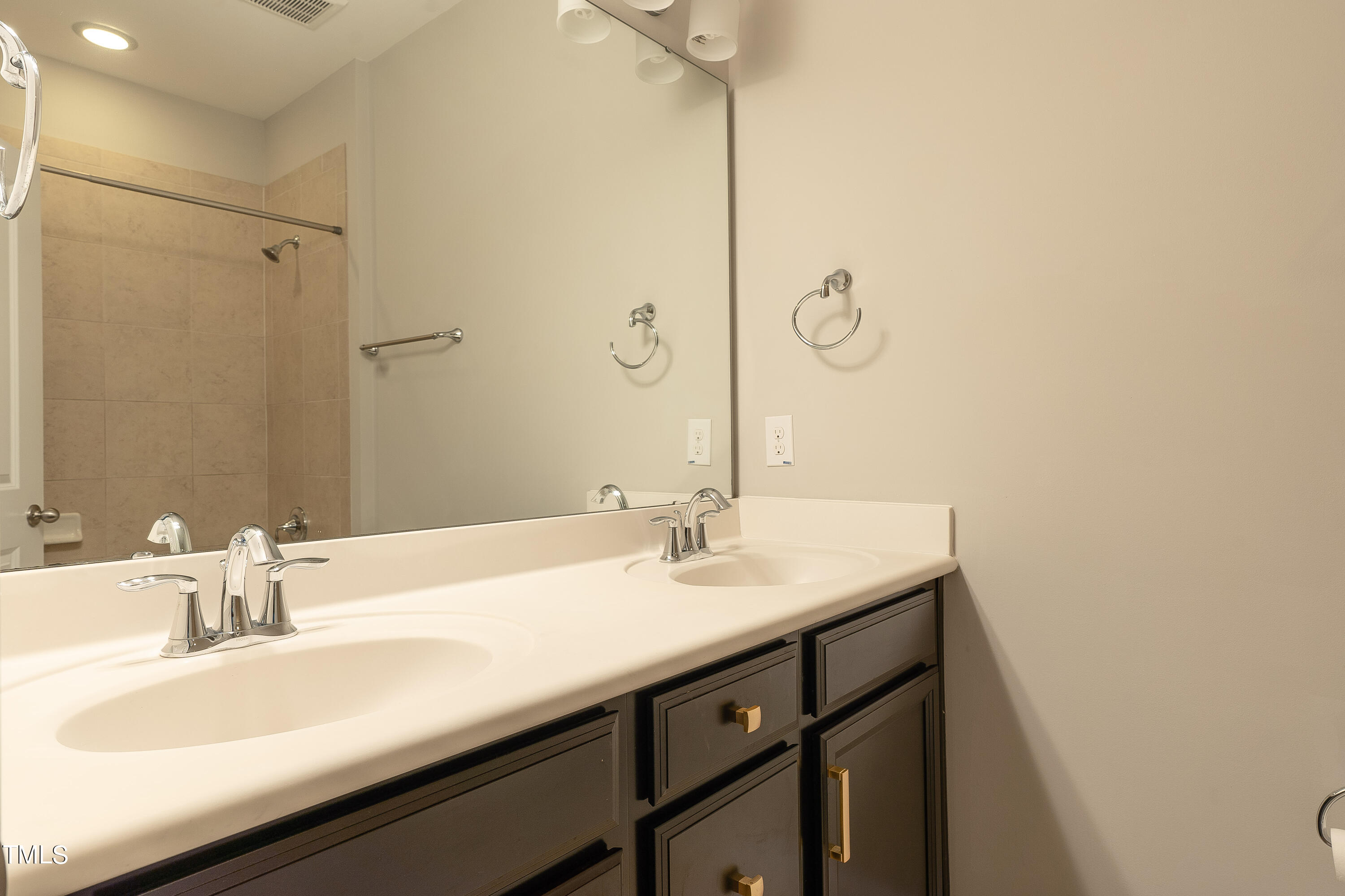 665 Old Dairy Drive Wake Forest, NC 27587 - Photo 17 of 30 a bathroom with a sink and a mirror