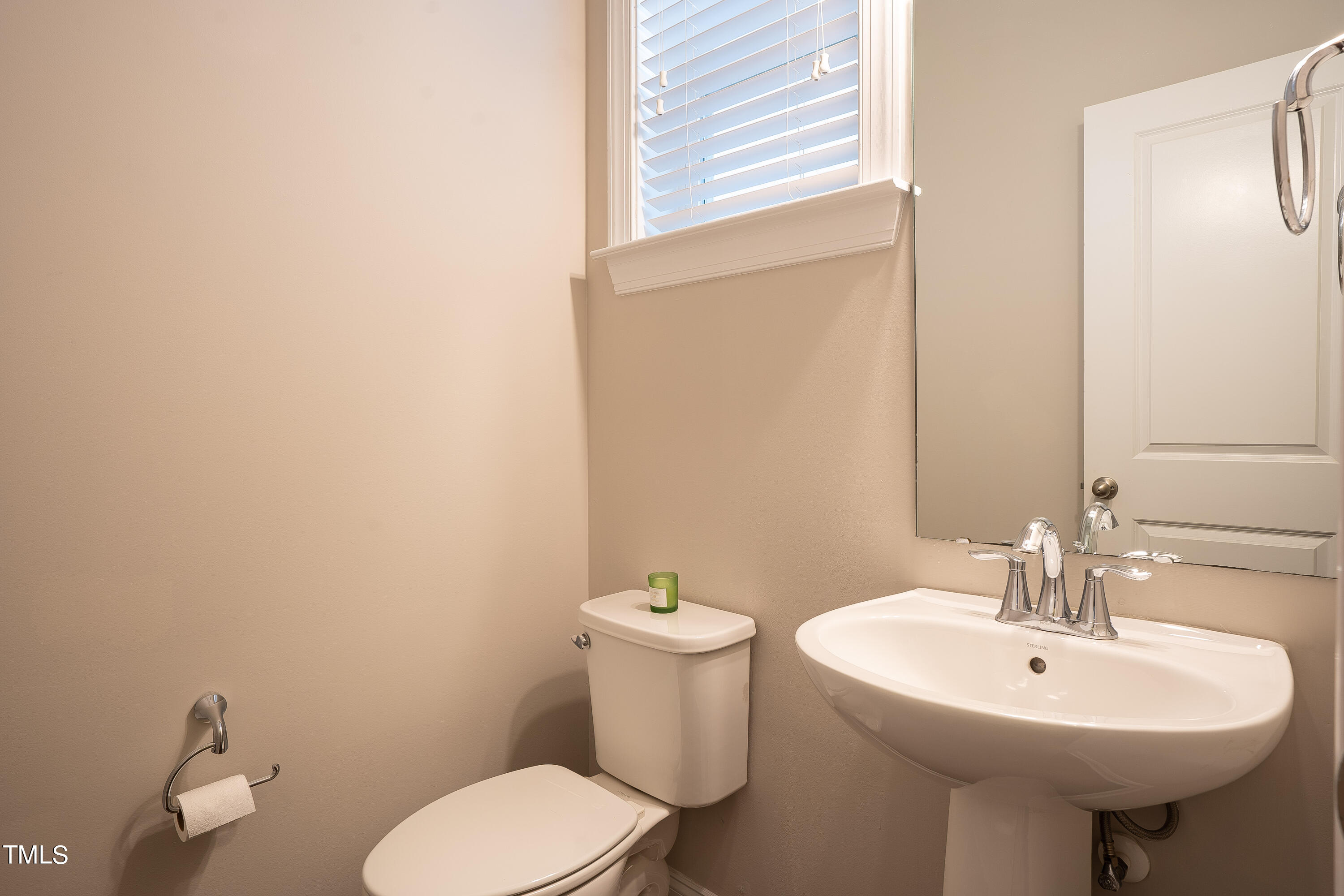 665 Old Dairy Drive Wake Forest, NC 27587 - Photo 22 of 30 a bathroom with a sink a toilet and mirror