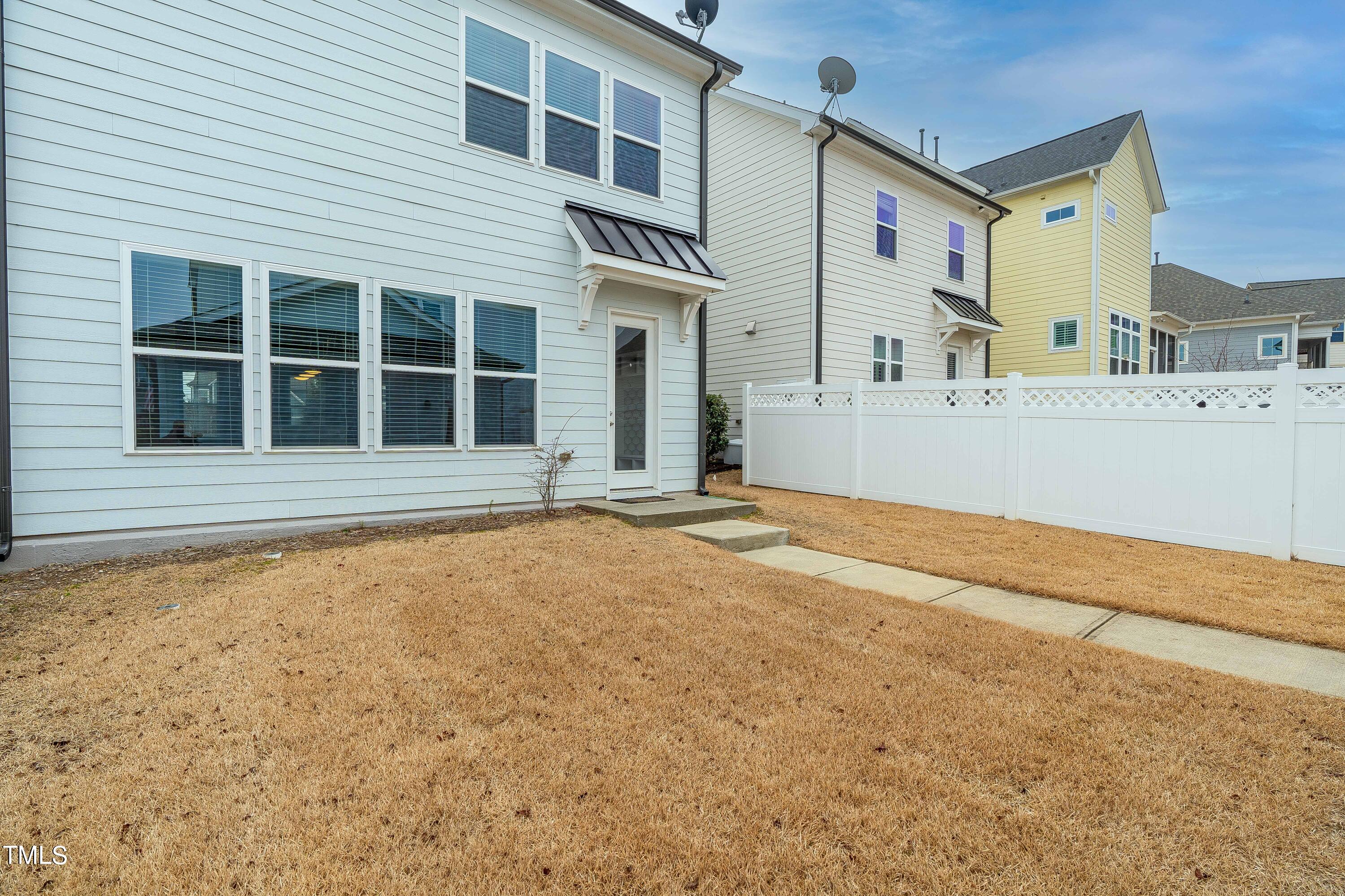 665 Old Dairy Drive Wake Forest, NC 27587 - Photo 23 of 30 a view of a house with a backyard