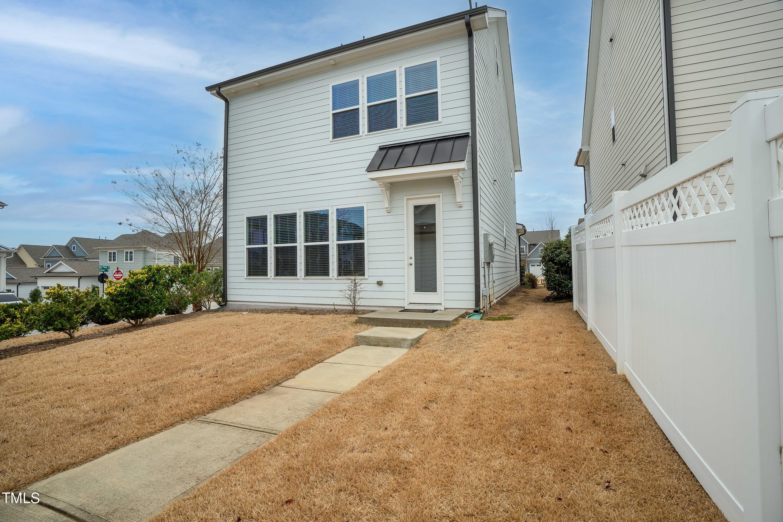 665 Old Dairy Drive Wake Forest, NC 27587 - Photo 24 of 30 a front view of a house with a yard