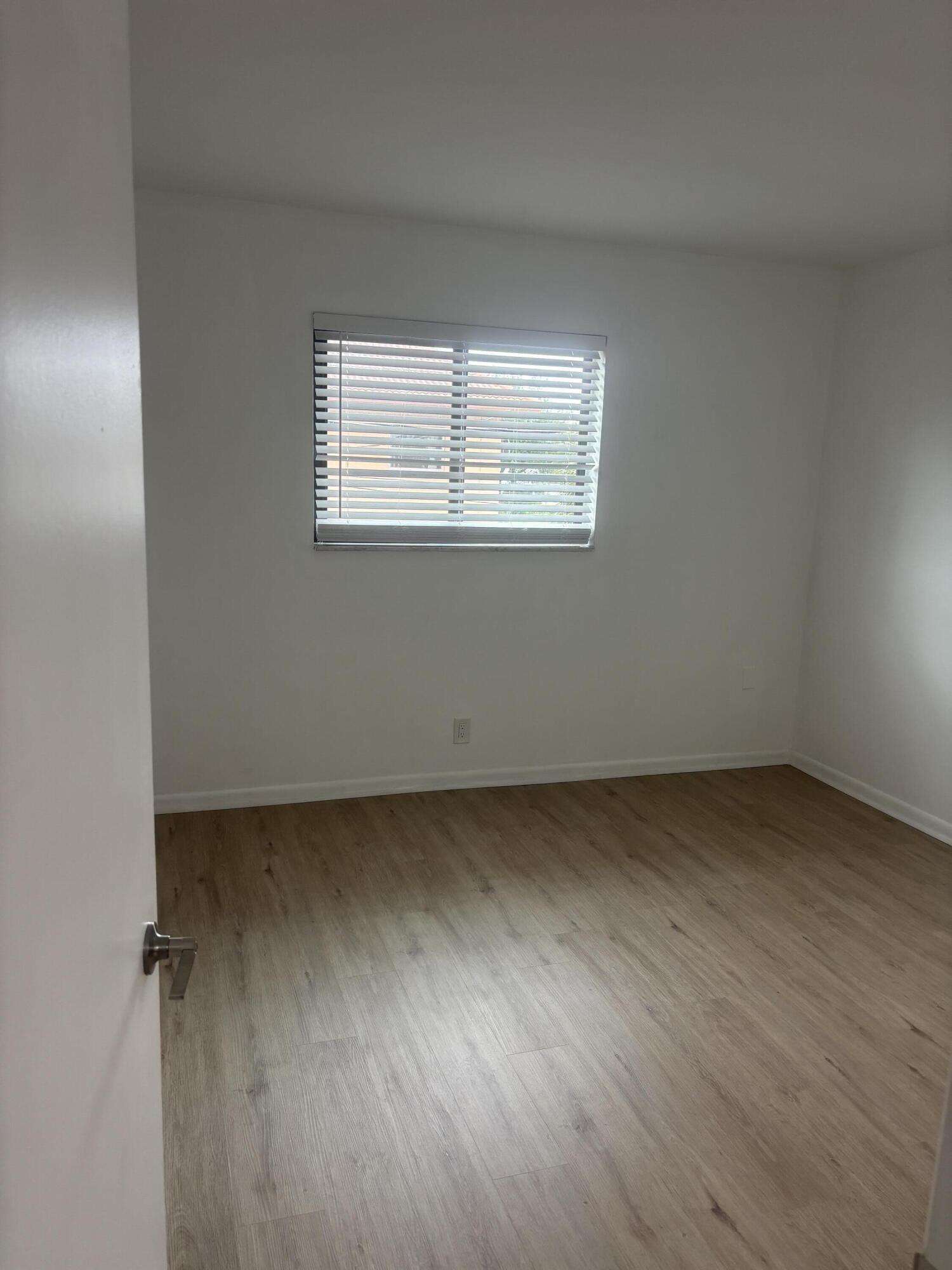 521 Northeast 45th Street Boca Raton, FL 33431 - Photo 15 of 17 an empty room with a window