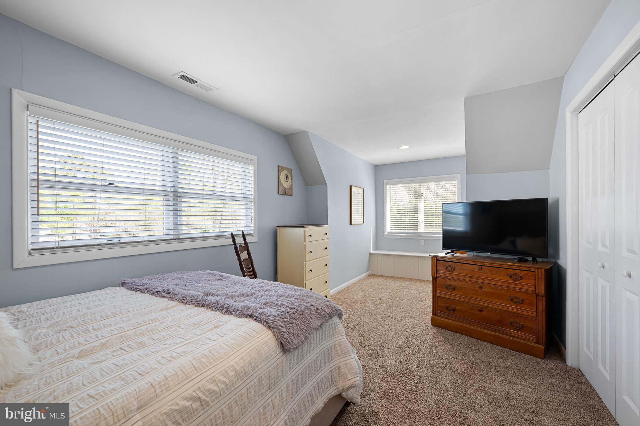 31186 Dogwood Acres Road Dagsboro, DE 19939 - Photo 24 of 43 a bedroom with a bed and a flat screen tv