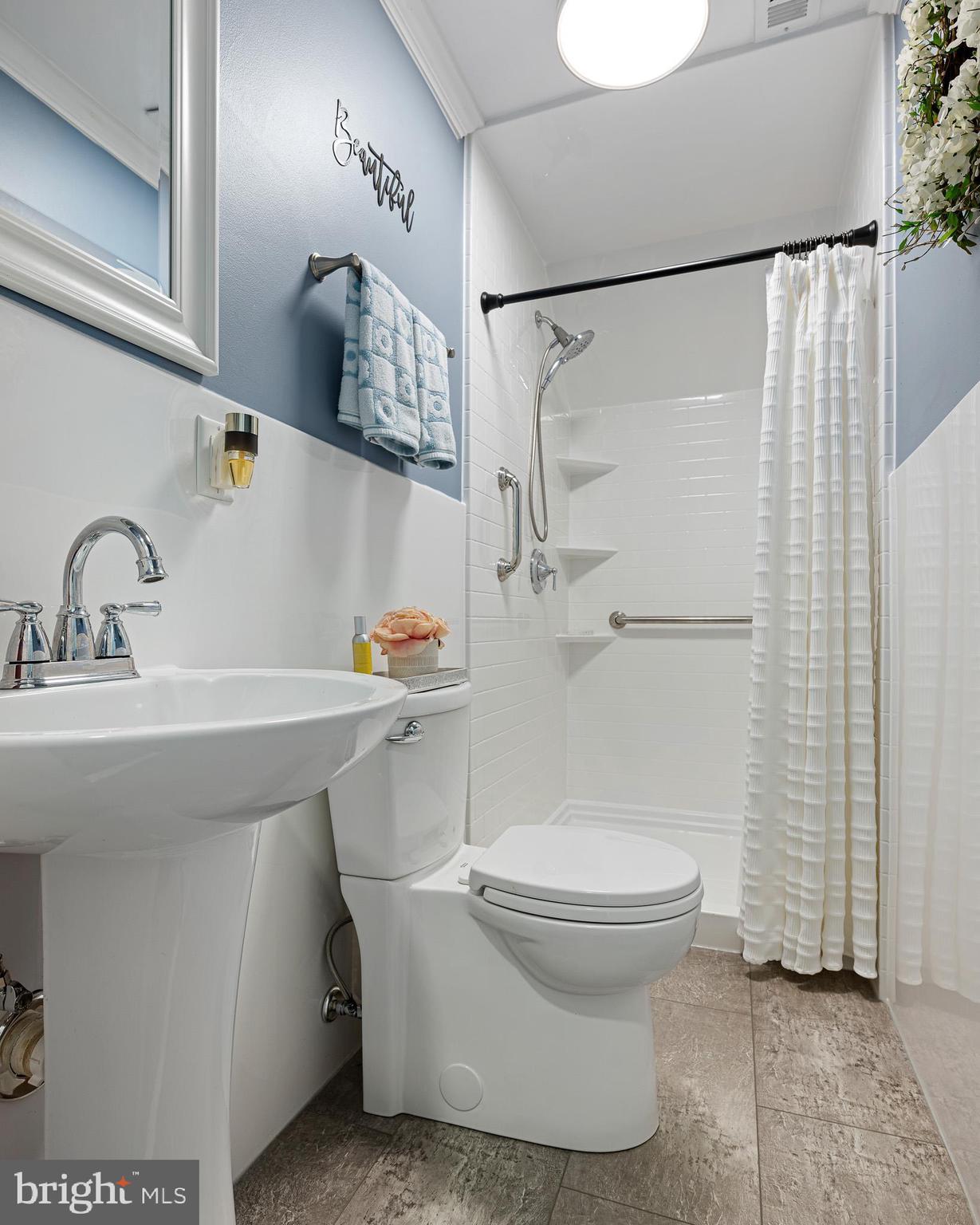 31186 Dogwood Acres Road Dagsboro, DE 19939 - Photo 29 of 43 a bathroom with a sink toilet and shower