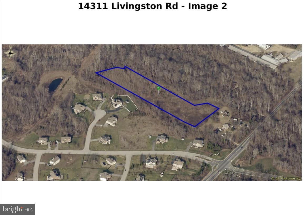 14311 Livingston Road Accokeek, MD 20607 - Photo 4 of 7 a black and white photo of a field