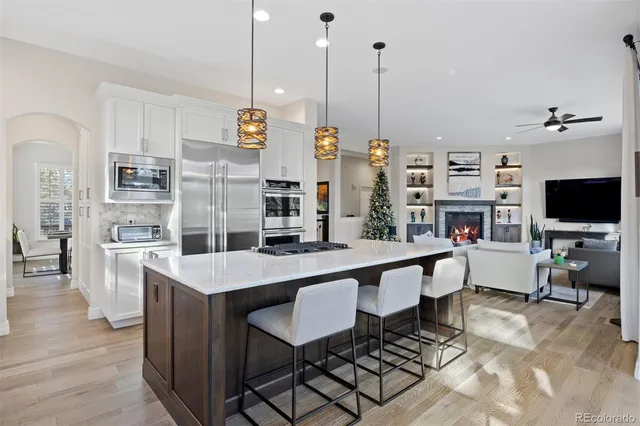 a large kitchen with a table and chairs in it