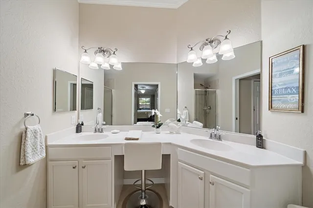 a bathroom with a double vanity sink and a mirror