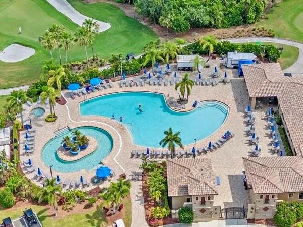 an aerial view of a house with garden space and outdoor seating