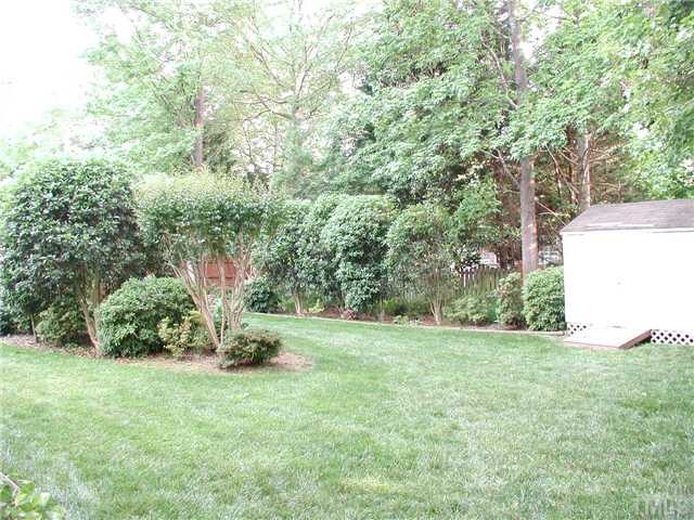 620 Sarah Lawrence Court Raleigh, NC 27609 - Photo 17 of 19 Private backyard with a storage shed.
