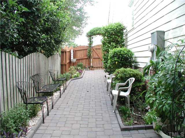 620 Sarah Lawrence Court Raleigh, NC 27609 - Photo 18 of 19 Side yard with stone paver walkway