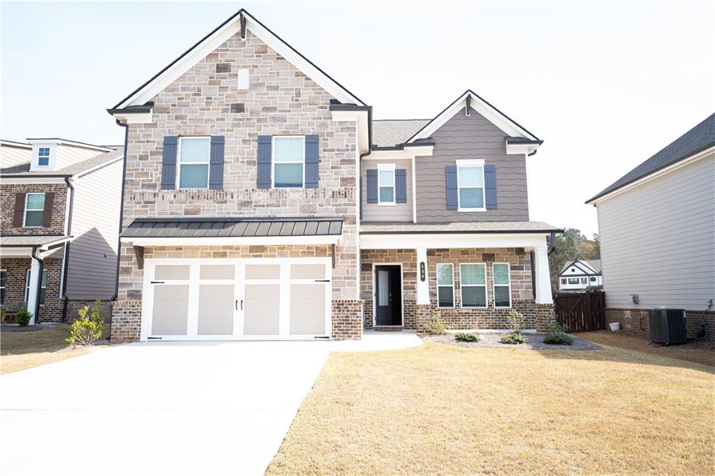 536 Sageton Court Grayson, GA 30017 - Photo 1 of 37 a front view of a house with a yard